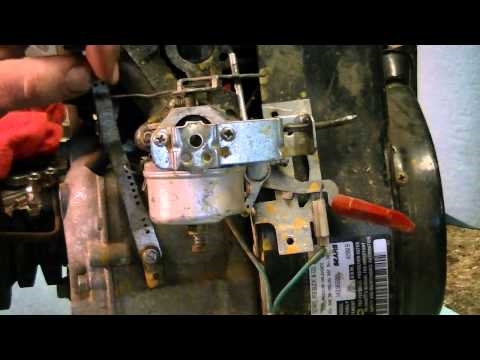 Como ajustar um carburador de máquina de jarda