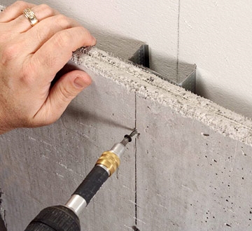 Come installare Hardi Cement Board per uno scudo termico dietro una stufa a legna