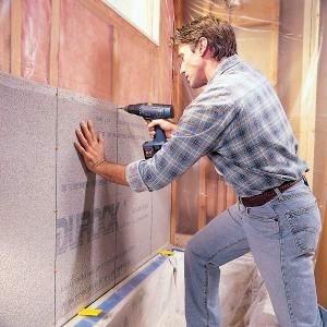 Comment installer des panneaux de fibres de ciment sur un mur de plâtre